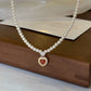 CORAL KISS NECKLACE